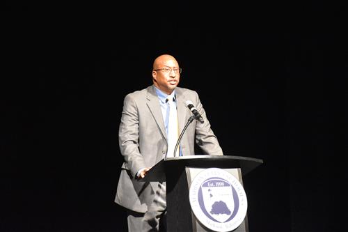 Travis Cummings at podium